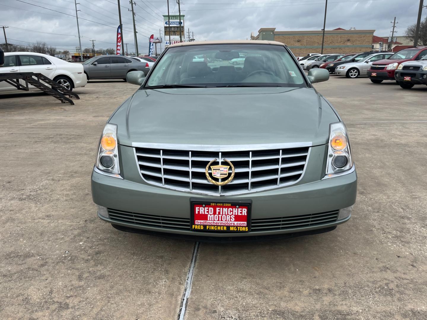 2006 green /TAN Cadillac DTS Sedan (1G6KD57Y96U) with an 4.6L V8 DOHC 32V engine, 4-Speed Automatic Overdrive transmission, located at 14700 Tomball Parkway 249, Houston, TX, 77086, (281) 444-2200, 29.928619, -95.504074 - Photo#1